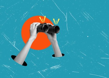 hands with binoculars looking into the distance