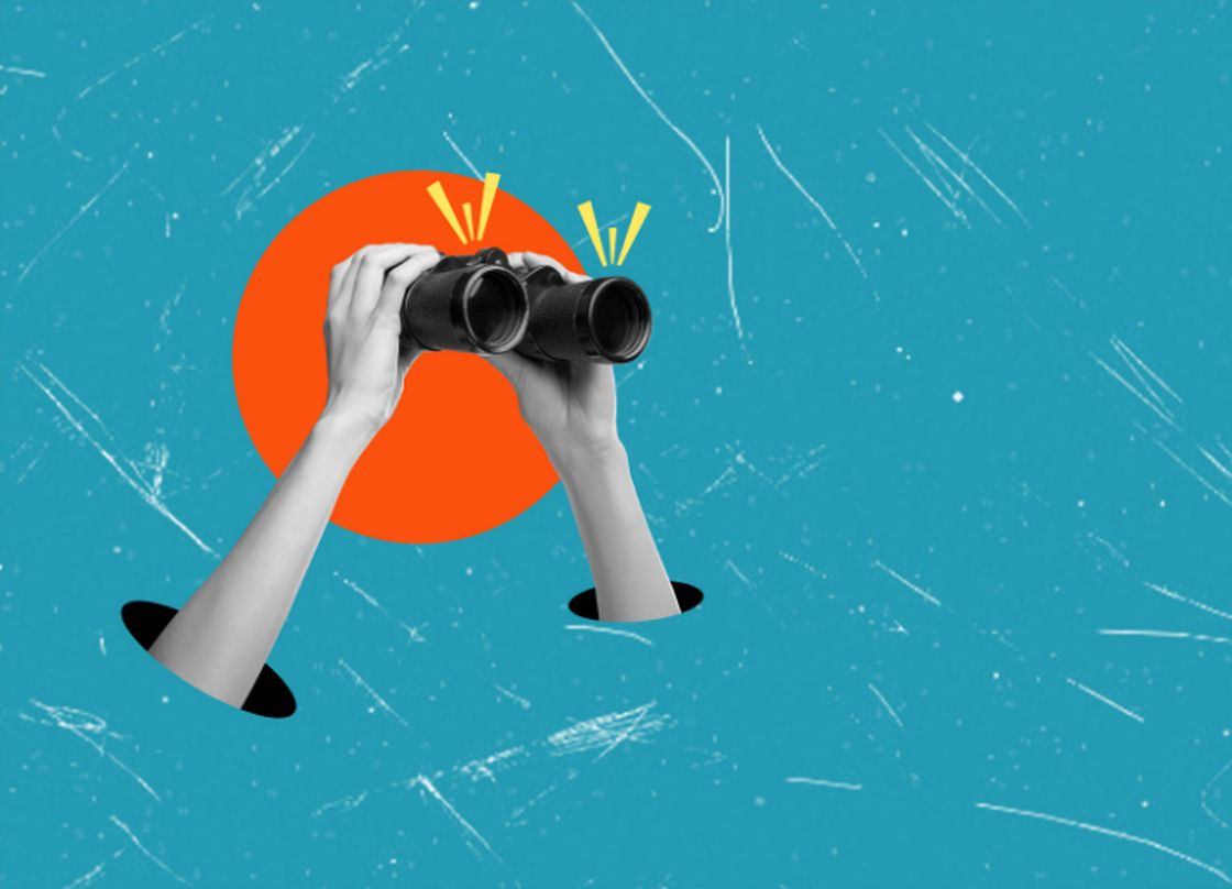 hands with binoculars looking into the distance