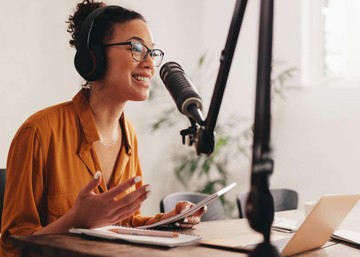 woman talking into a microphone