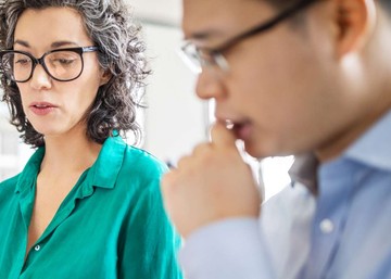 woman with glasses in business meeting