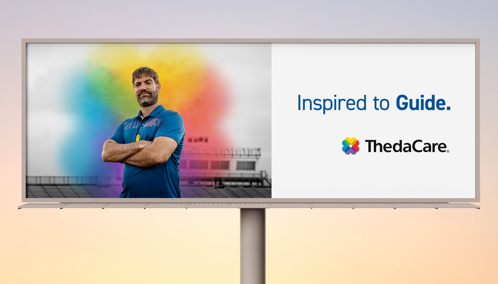 billboard showing football coach with a splash of color behind him