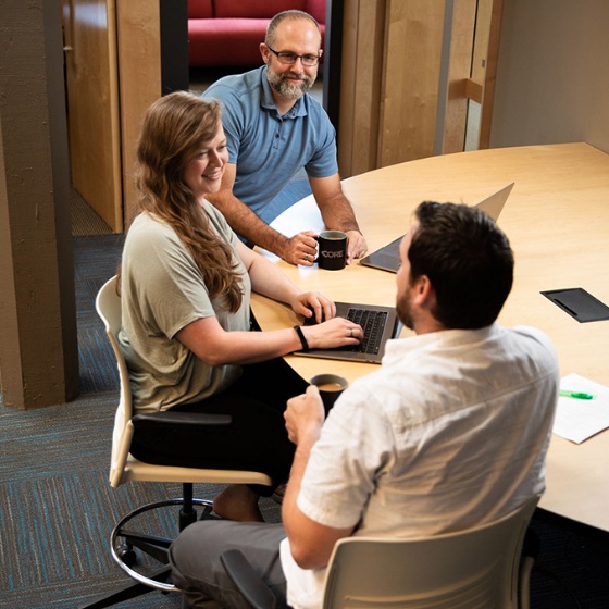 Core employees conversing at Half-Moon.